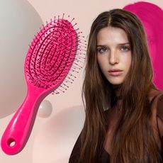 woman with great hair next to a hairbrush and. pill box