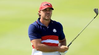 Brooks Koepka takes a shot during the 2023 Ryder Cup