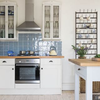 kitchen with white cabinet and wooden worktop