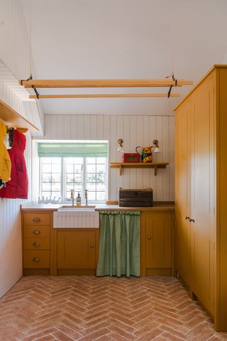 Yellow utility room by British Standard by plain English cupboards