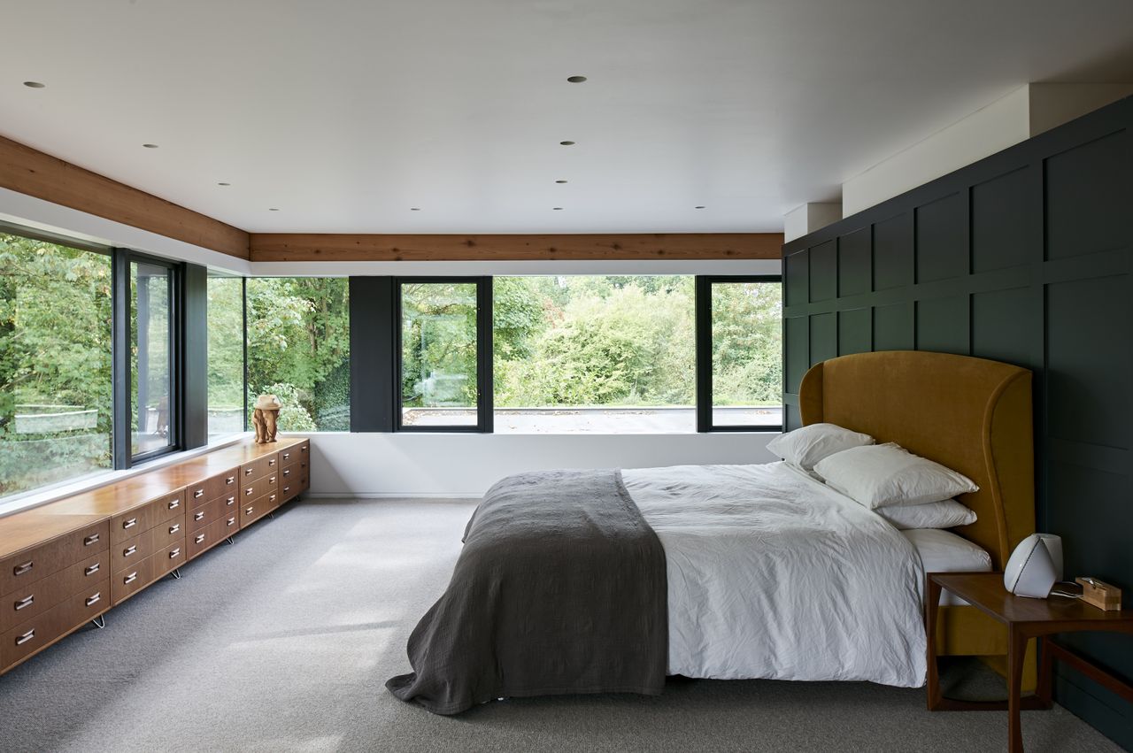 master bedroom with green wall panelleing