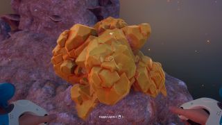 Subnautica 2 sulfur: A player looking at a large sulfur crystal embedded in a rocky pillar.
