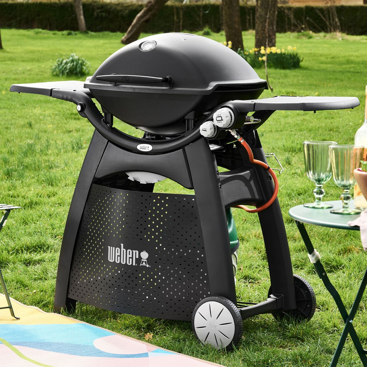 The Weber Q3200 BBQ on a grass lawn