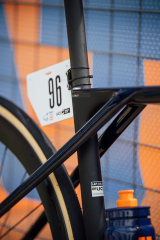 Oscar Onley's Lapierre bike leaning against a fence at the Tour Down Under