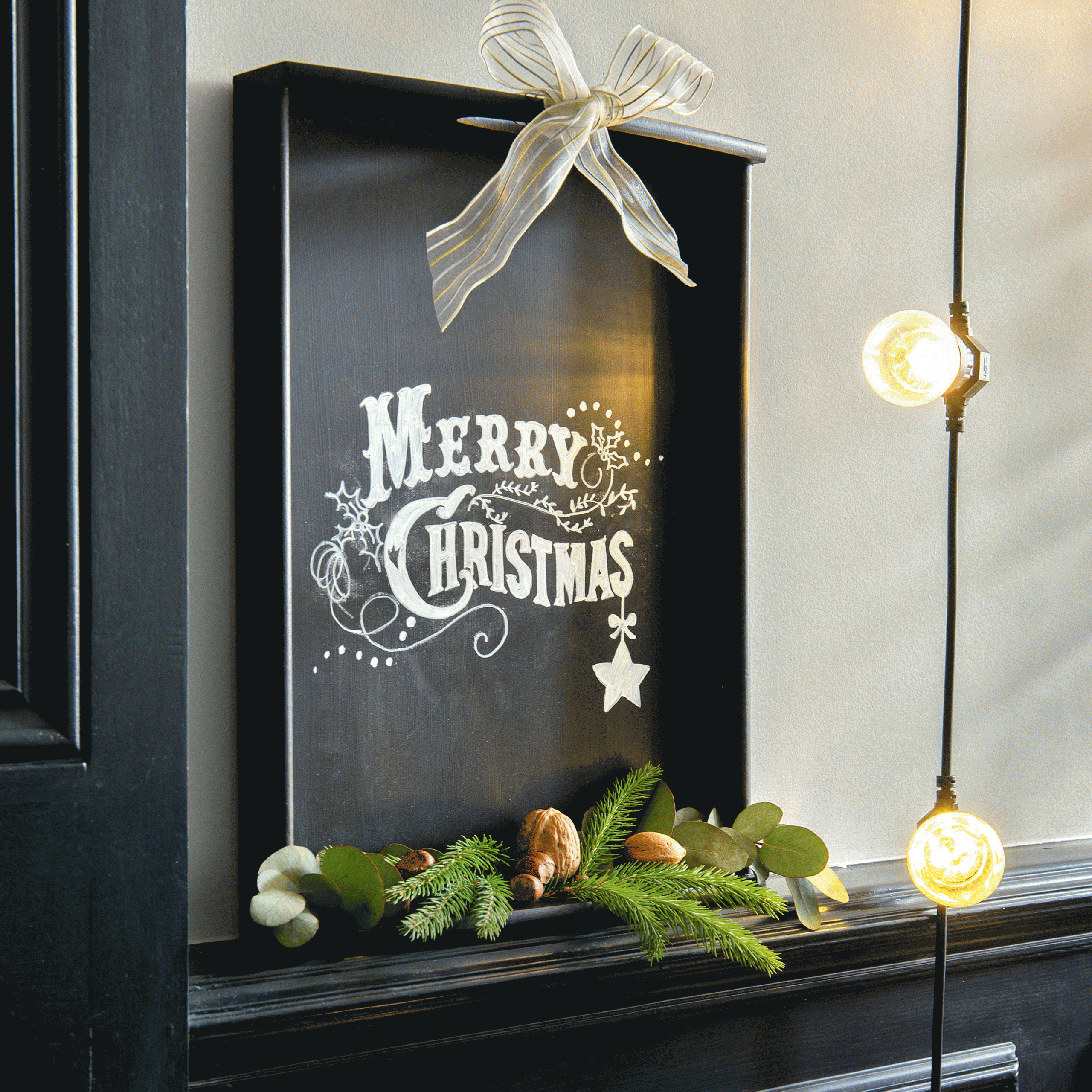 entrance with merry christmas board