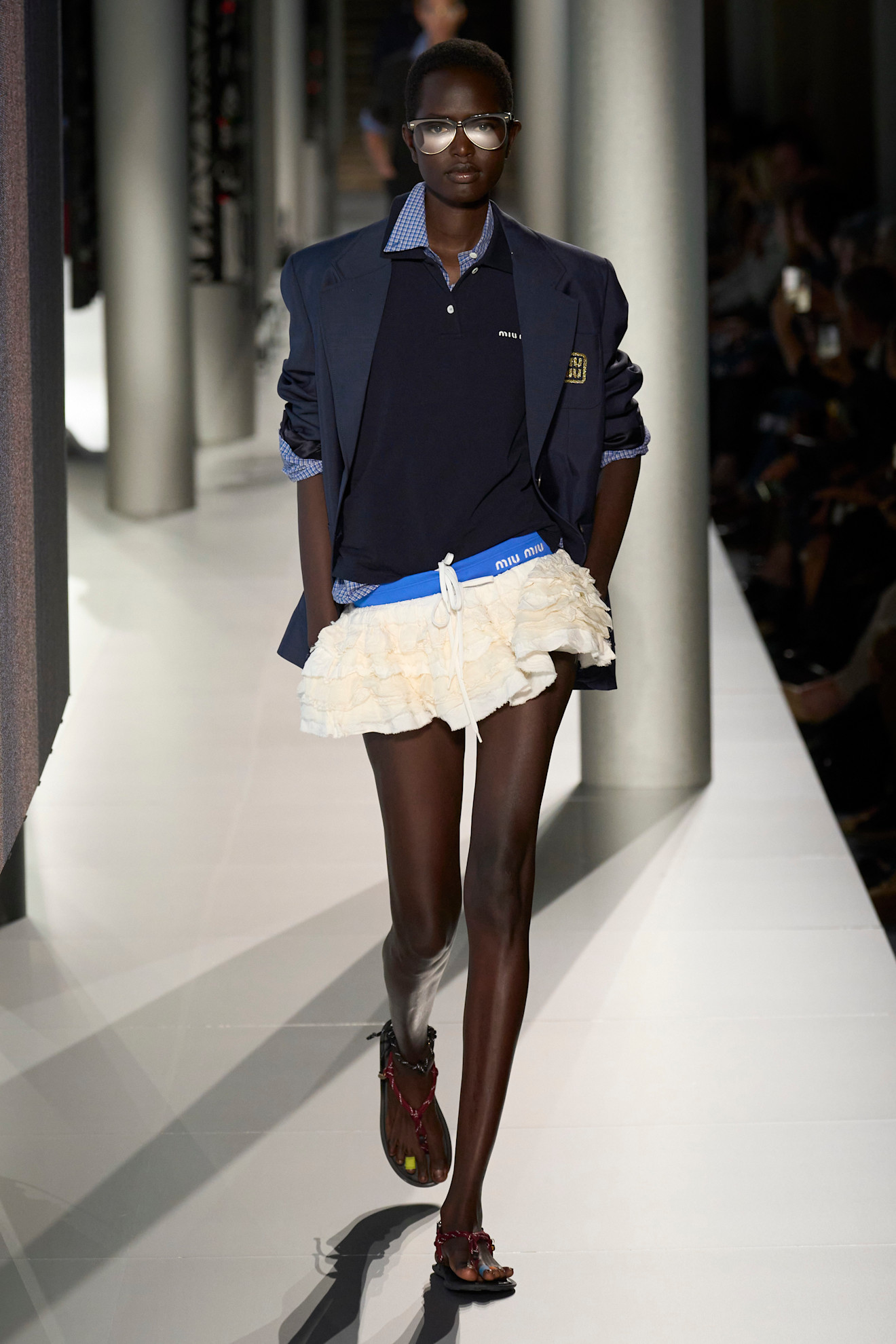 Model wears Miu Miu brown rope sandals on the SS24 runway.