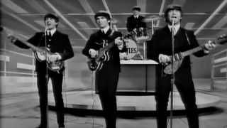 Paul McCartney, John Lennon, Ringo Starr and George Harrison performing on The Ed Sullivan Show