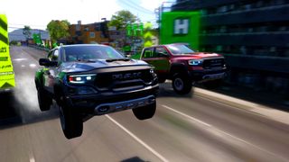 Forza Horizon 6 screenshot showing two RAM TRX pickup trucks racing side-by-side through a city street, with motion blur and Festival branding visible in the background.