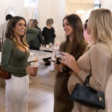 TAYLOR FRANKIE PAUL, MIKAYLA MATTHEWS and another women talking at an event in the secret lives of mormon wives season 3