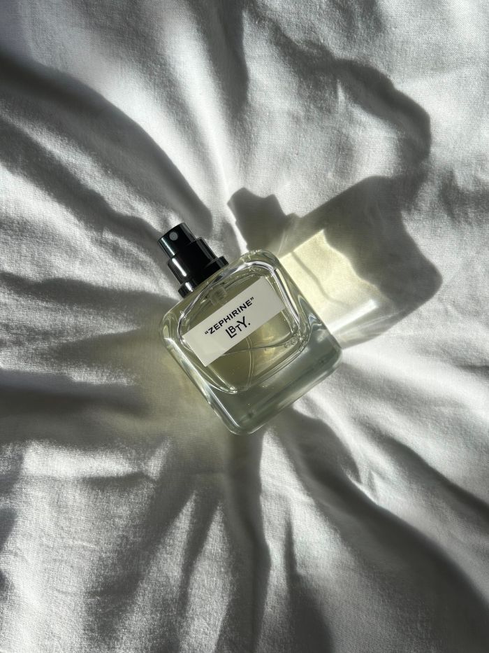 LBTY Zephirine shot in the sunlight on a white bedsheet