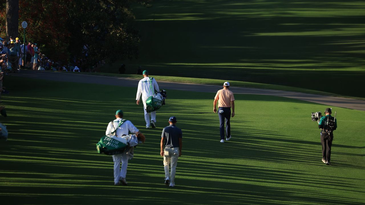 Scottie Scheffler and Collin Morikawa walk down 18 on Sunday at The 2024 Masters