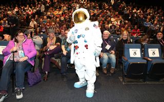 A costume Apollo astronaut poses with the audience during the "Apollo 11" premiere at the 2019 Sundance Film Festival in Park City, Utah on Thursday, Jan. 24, 2019.