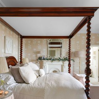 wooden four-poster bed in a classic style bedroom in Victorian home
