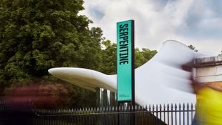 Zaha Hadid's tensile structure for Serpentine North Galleries featuring banner with Serpentine wordmark by Hingston Studio