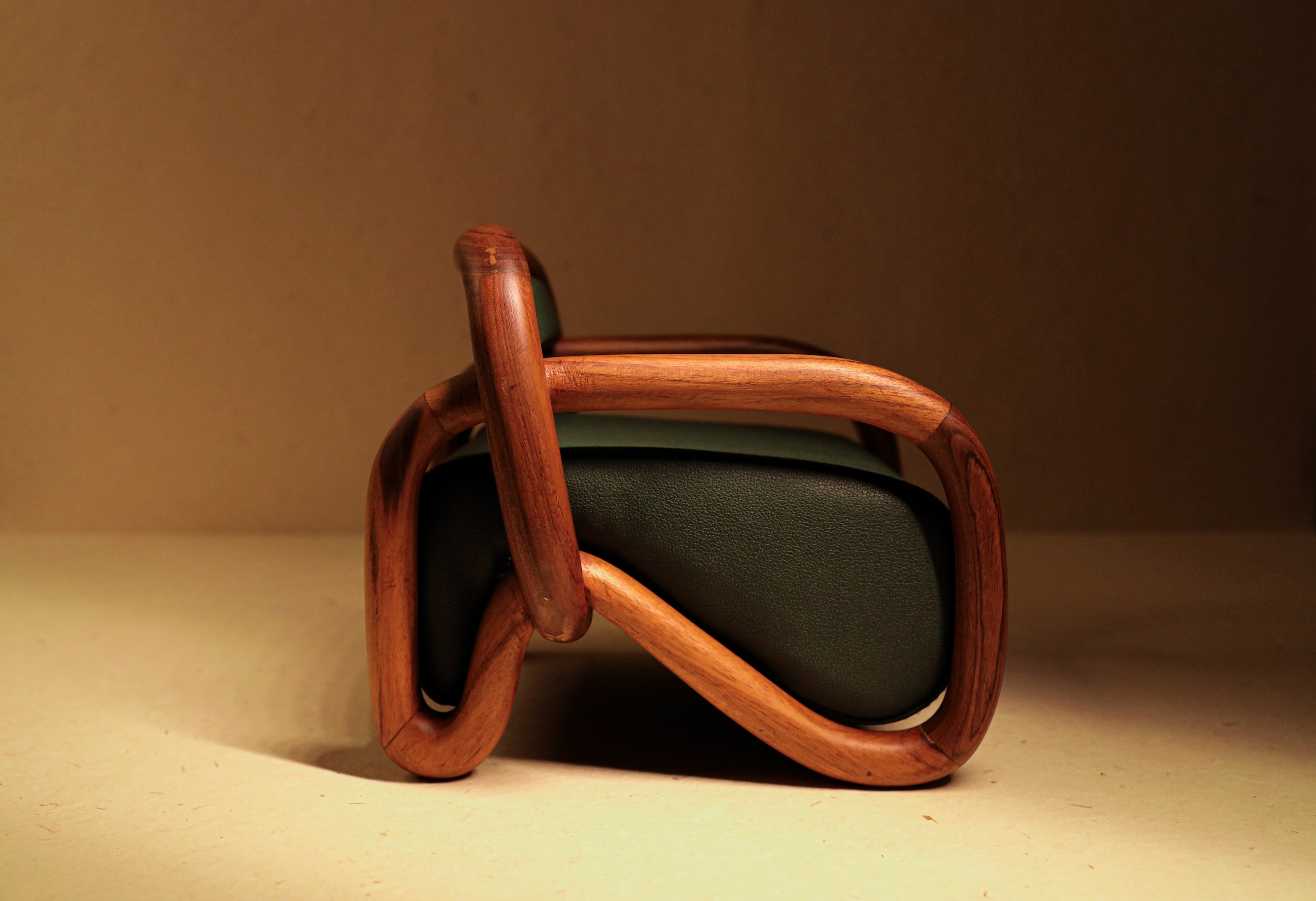 teak armchair in empty space