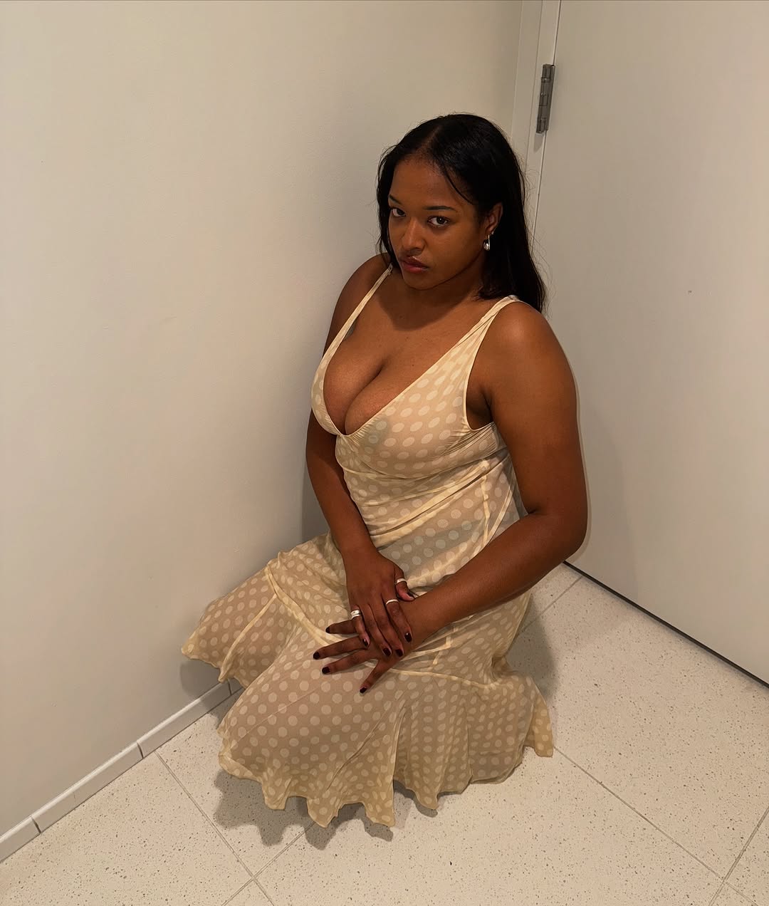 woman wearing sheer printed midi dress summer 2025