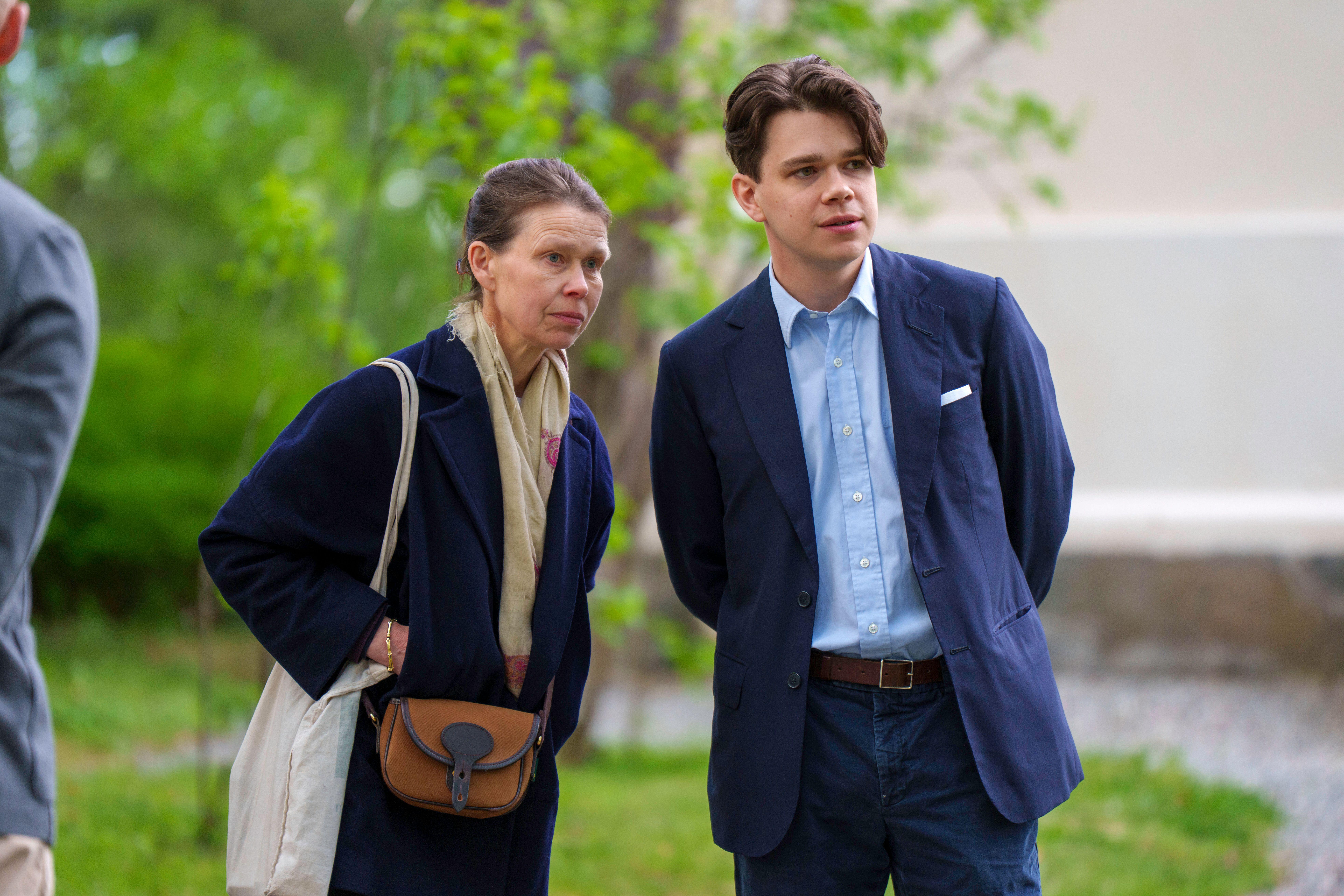 Sarah Chatto and Sam Chatto both wearing blue jackets standing in front of a tree