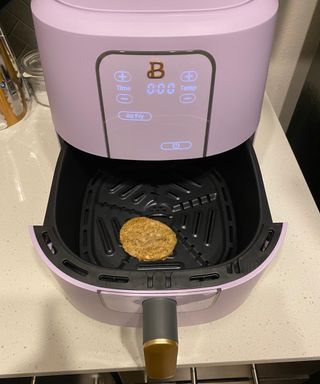 Reheating a sausage patty in the Beautiful by Drew Barrymore air fryer