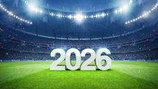 A soccer stadium with the text "2026" displayed on the field. 
