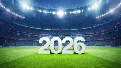 A soccer stadium with the text "2026" displayed on the field.