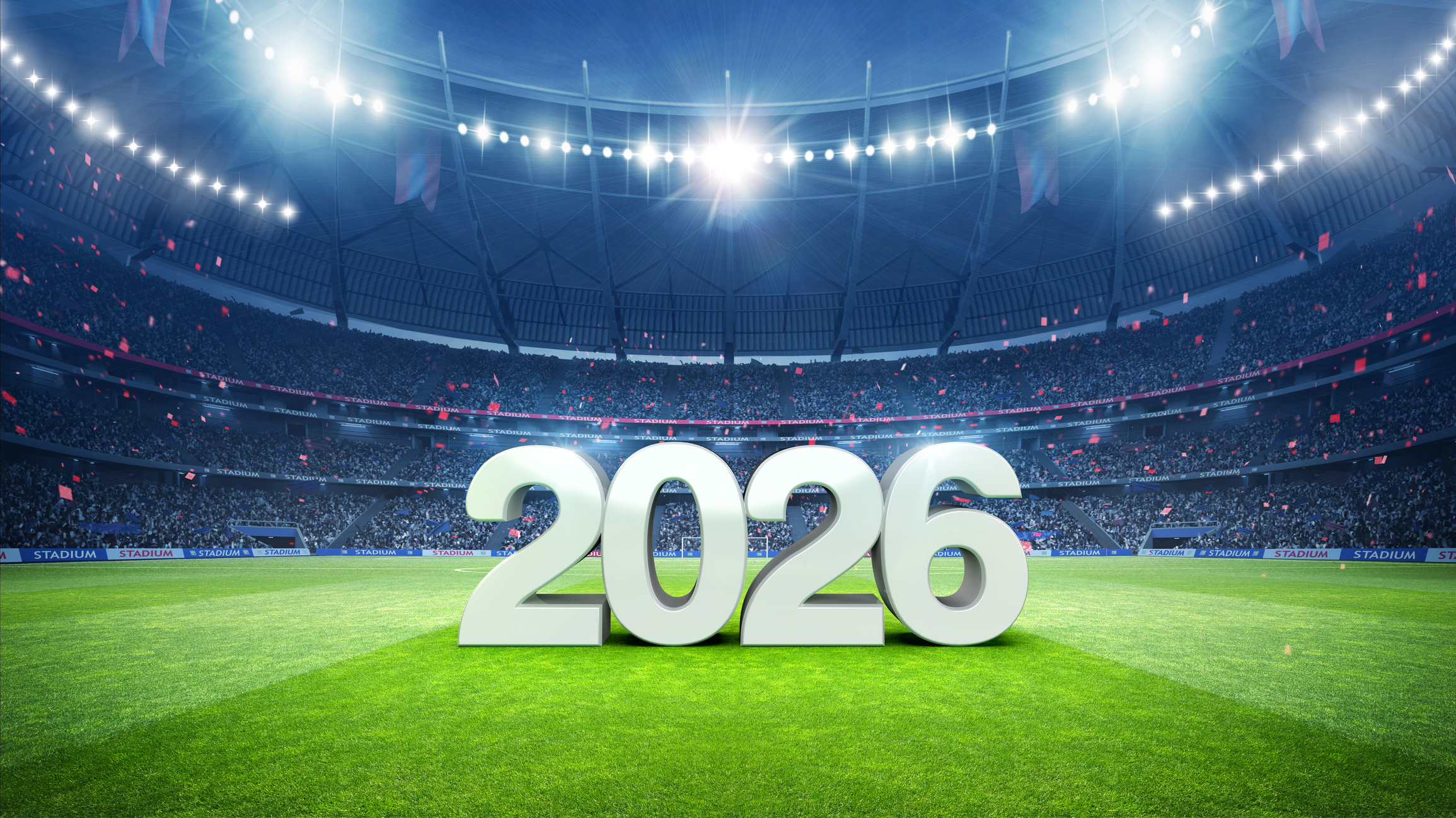 A soccer stadium with the text "2026" displayed on the field. 