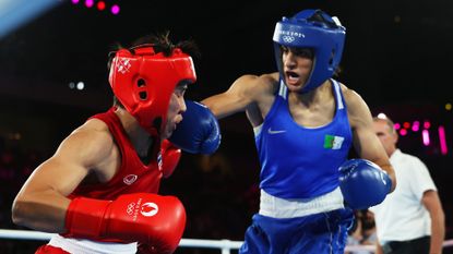 Imane Khelif lands a punch on Thailand&#039;s Janjaem Suwannapheng during the Women&#039;s 66kg semi-final on Tuesday