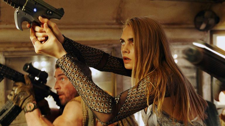 Hand, Wrist, Camera, Gun accessory, Shooting, Long hair, Air gun, Revolver, Bracelet, Home game console accessory,