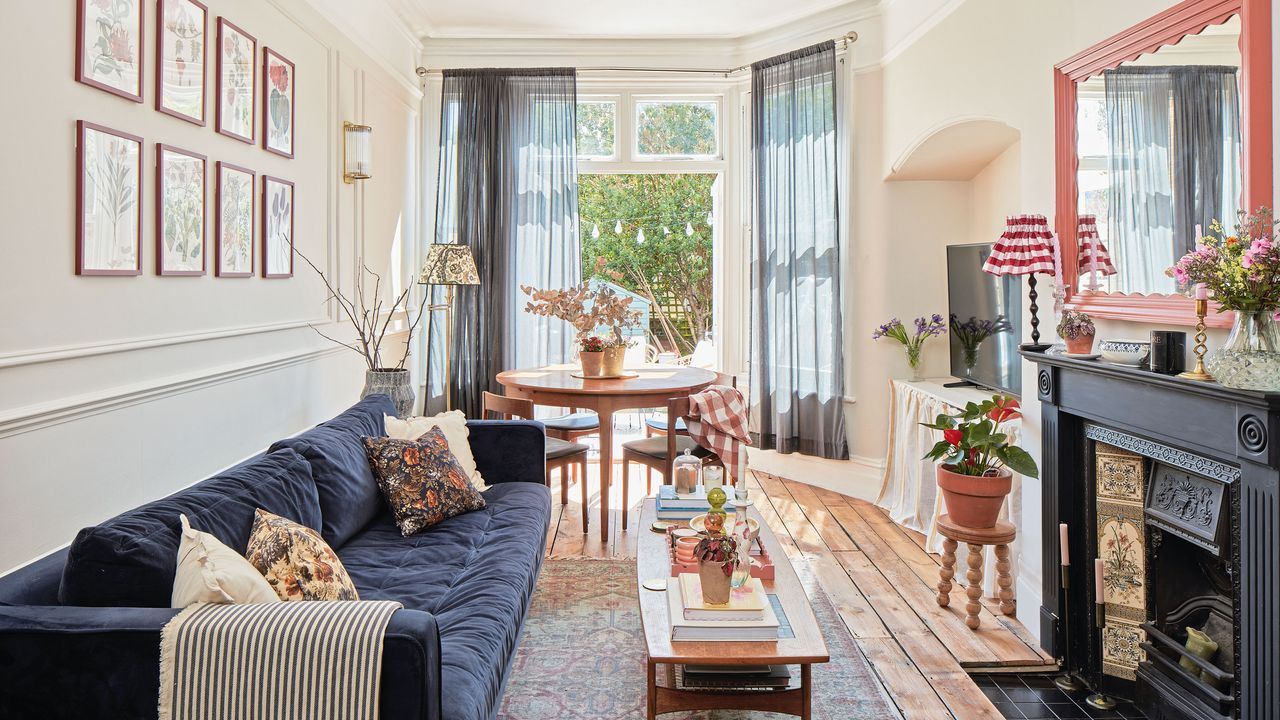 Long living room with panelled wall and dining area to the end