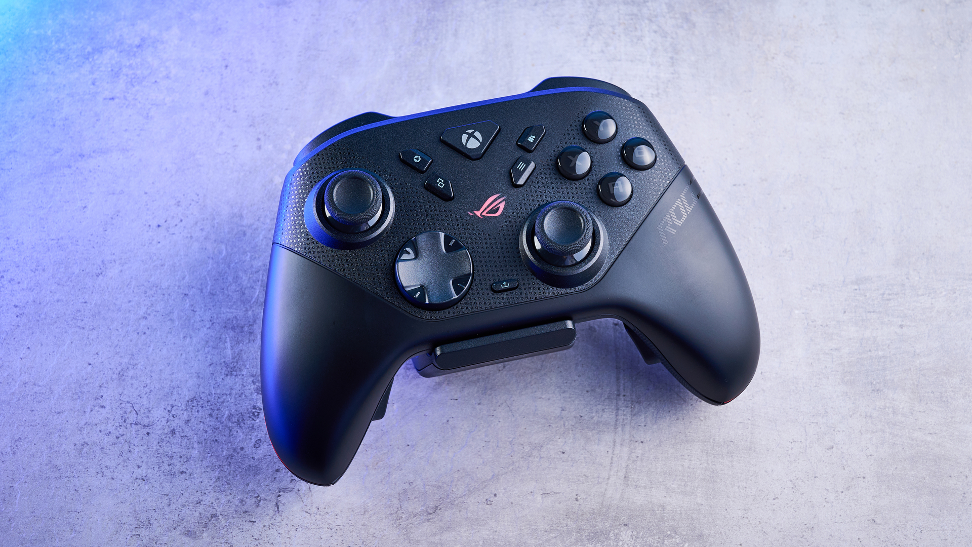 A black Asus ROG Raikiri II PC and Xbox controller