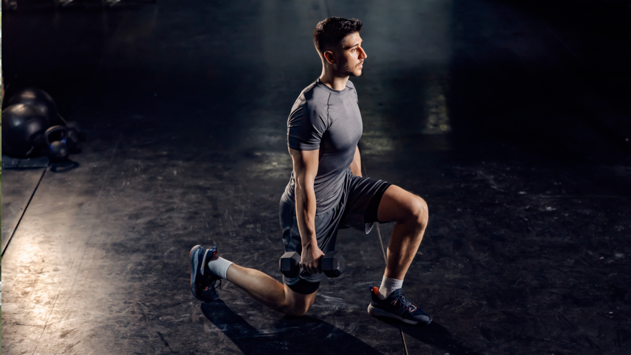 A man performing dumbbell lunges