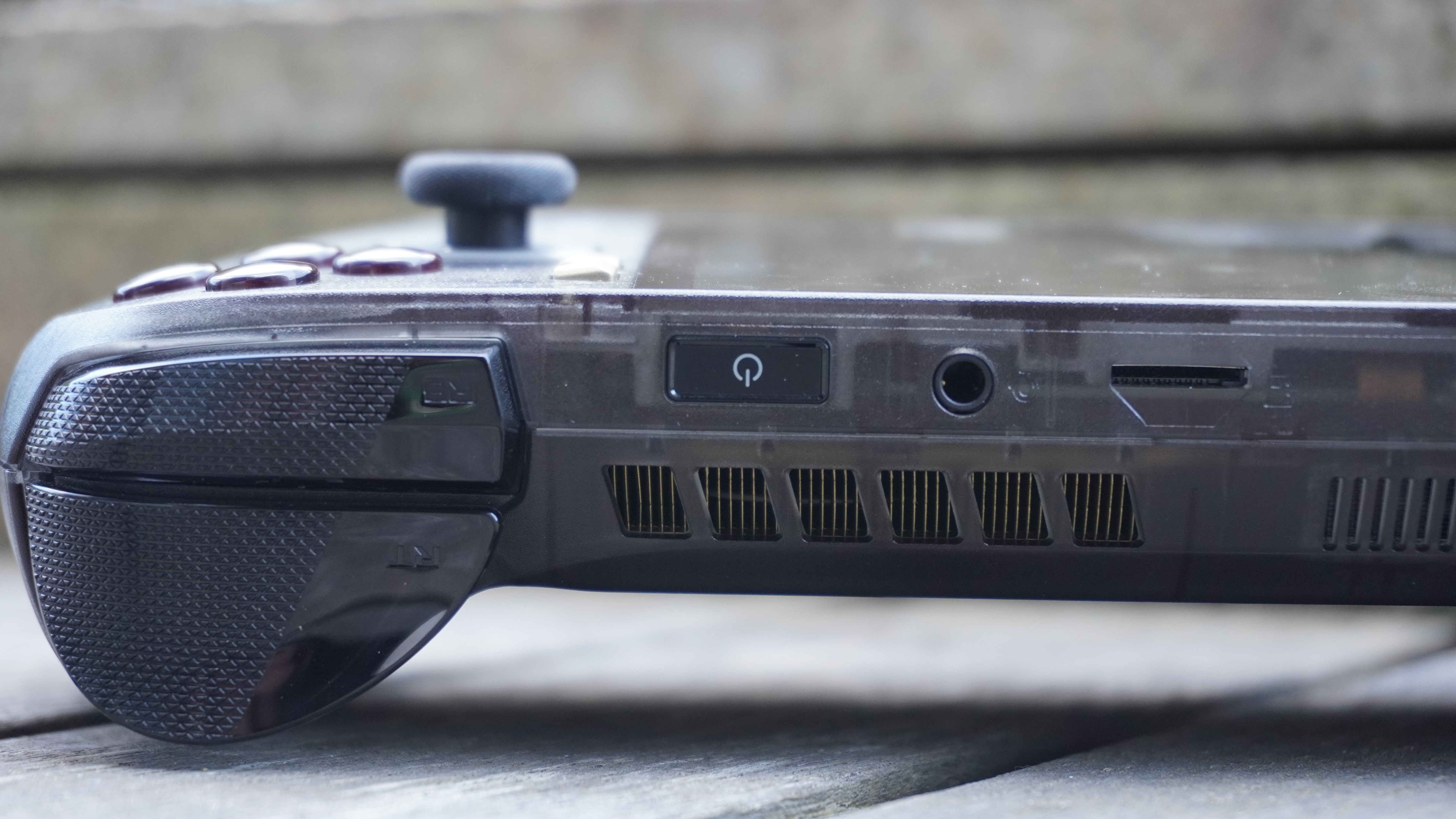 A closeup shot of the bumpers, triggers and microSD Express card slot on the Asus ROG Xbox Ally X20
