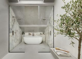 loft shower space with bathtub glass doors, double shower, marble style walls