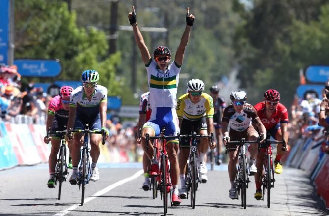 Steele von Hoff raises his arms in celebration