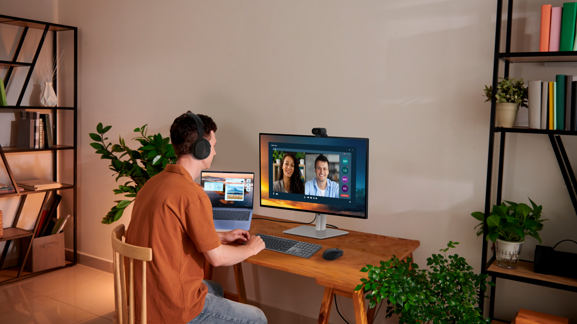 Dell Pro laptop being used by a person at a desk, connected to an external monitor