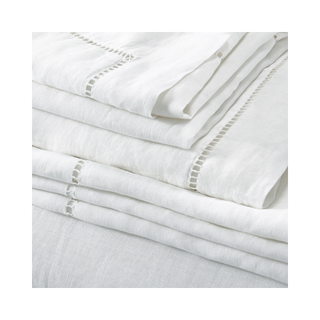 white linen sheets with ladder stitch detail
