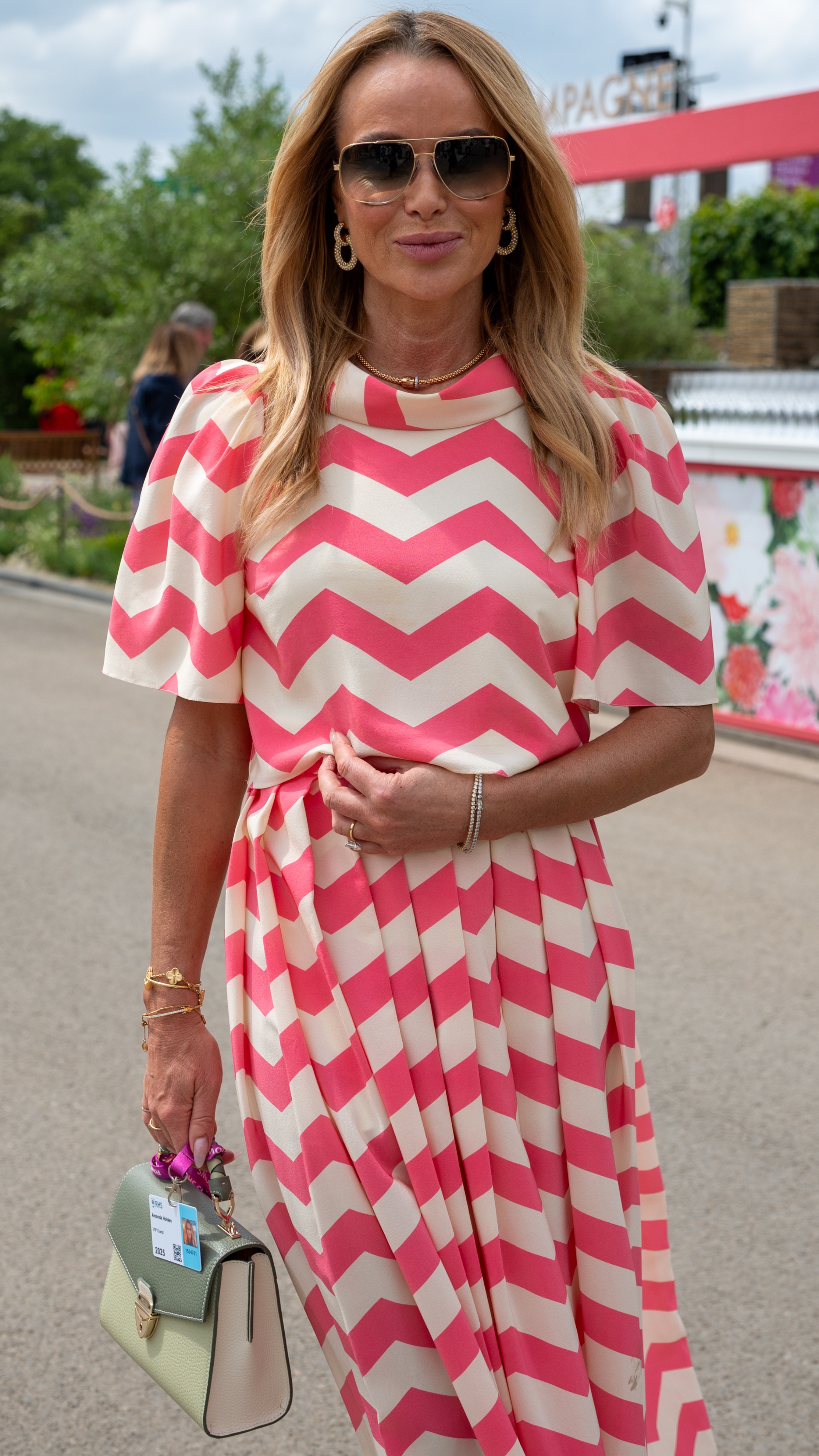 Amanda Holden smiles as she attends the RHS Chelsea Flower Show 2025