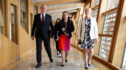 First Minister John Swinney, with his deputy Kate Forbes and Finance Secretary Shona Robison, in the Scottish Parliament Building
