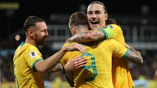 Jackson Irvine of Australia celebrates a goal with Adam Taggart.