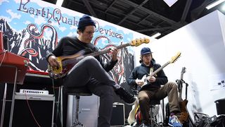 Juan Alderete, bassist for The Mars Volta, and Nick Reinhart, guitarist for Tera Melos, perform for an artist demo at the EarthQuaker Devices booth during the NAMM Show on January 25, 2019, at the Anaheim Convention Center in Anaheim, CA