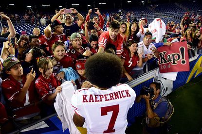 49er's quarterback Colin Kaepernick greets fans