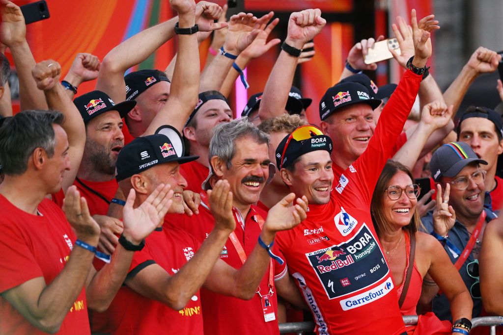 MADRID SPAIN SEPTEMBER 08 LR Team Manager Ralph Denk final overall winner and Primoz Roglic of Slovenia Red Leader Jersey and Team Red Bull Bora hansgrohe celebrates at podium as Red Leader Jersey winner during the La Vuelta 79th Tour of Spain 2024 Stage 21 a 246km individual time trial stage from Madrid to Madrid UCIWT on September 08 2024 in Madrid Spain Photo by Dario BelingheriGetty Images