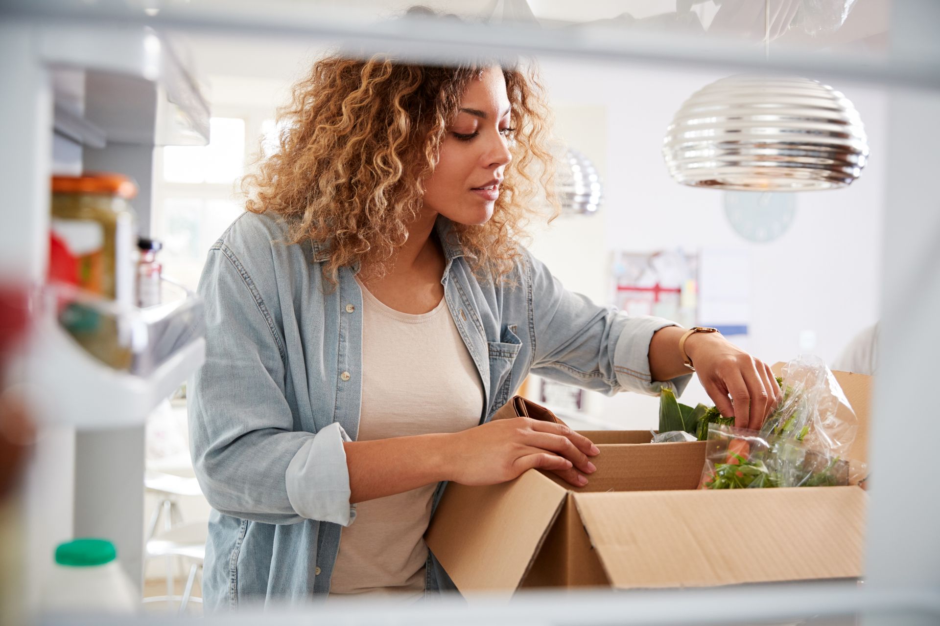 woman unloading her shopping