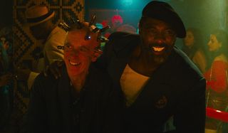 The Thinker and Bloodsport pretending to be pals at the bar in The Suicide Squad.