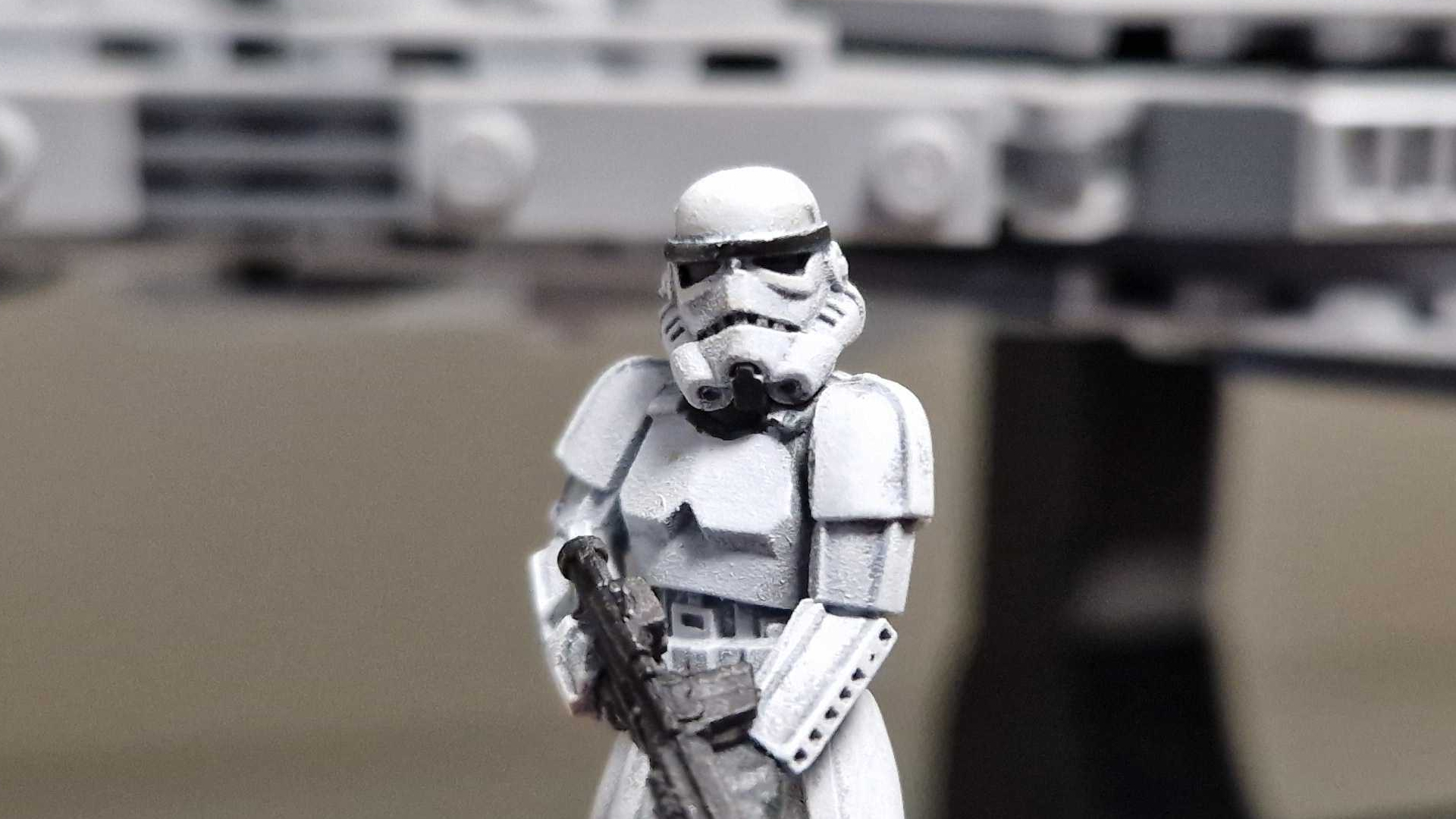 A painted Stormtrooper model in front of a Lego set