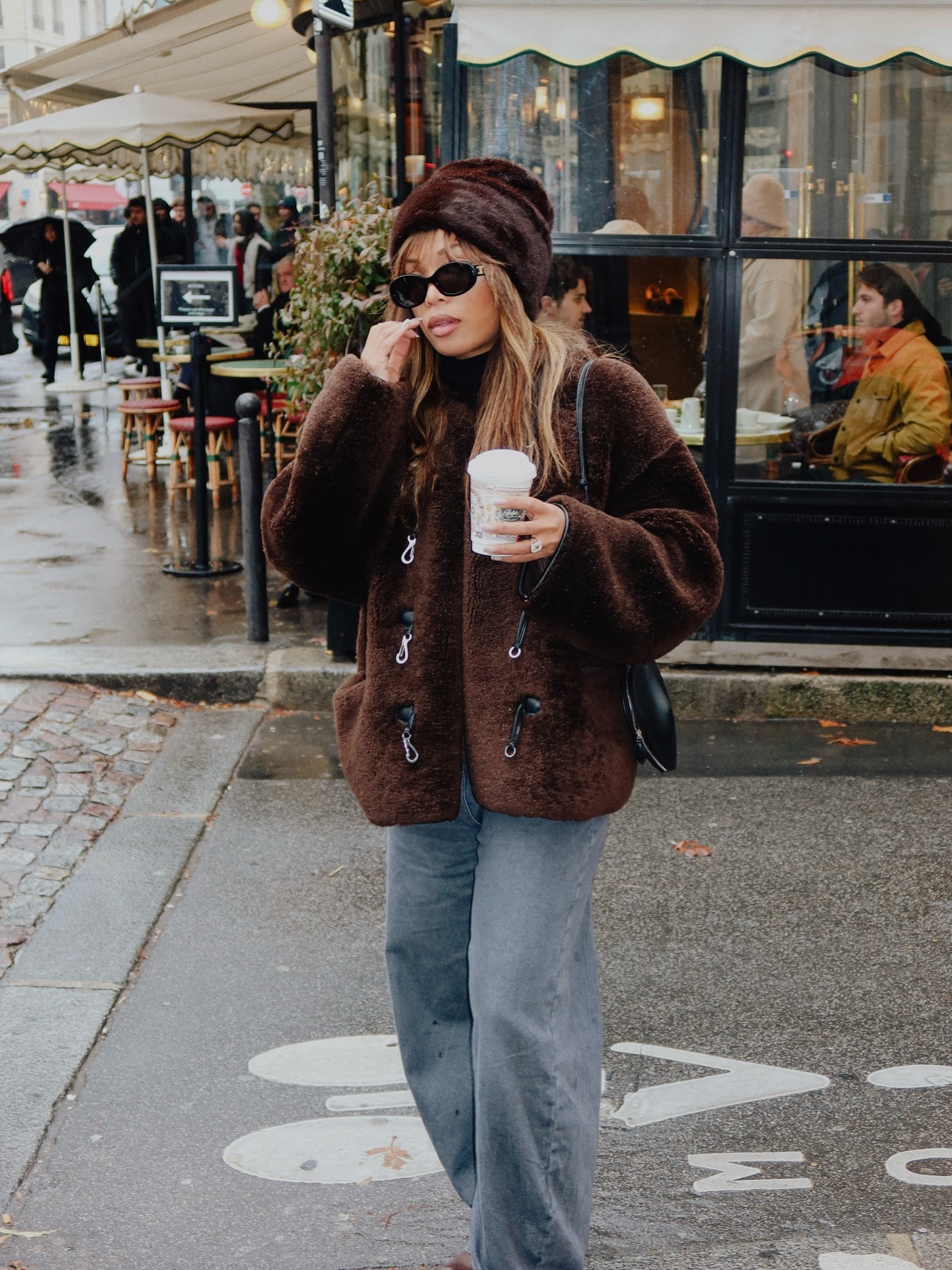@slipintostyle wearing a faux fur hat outside in Paris.