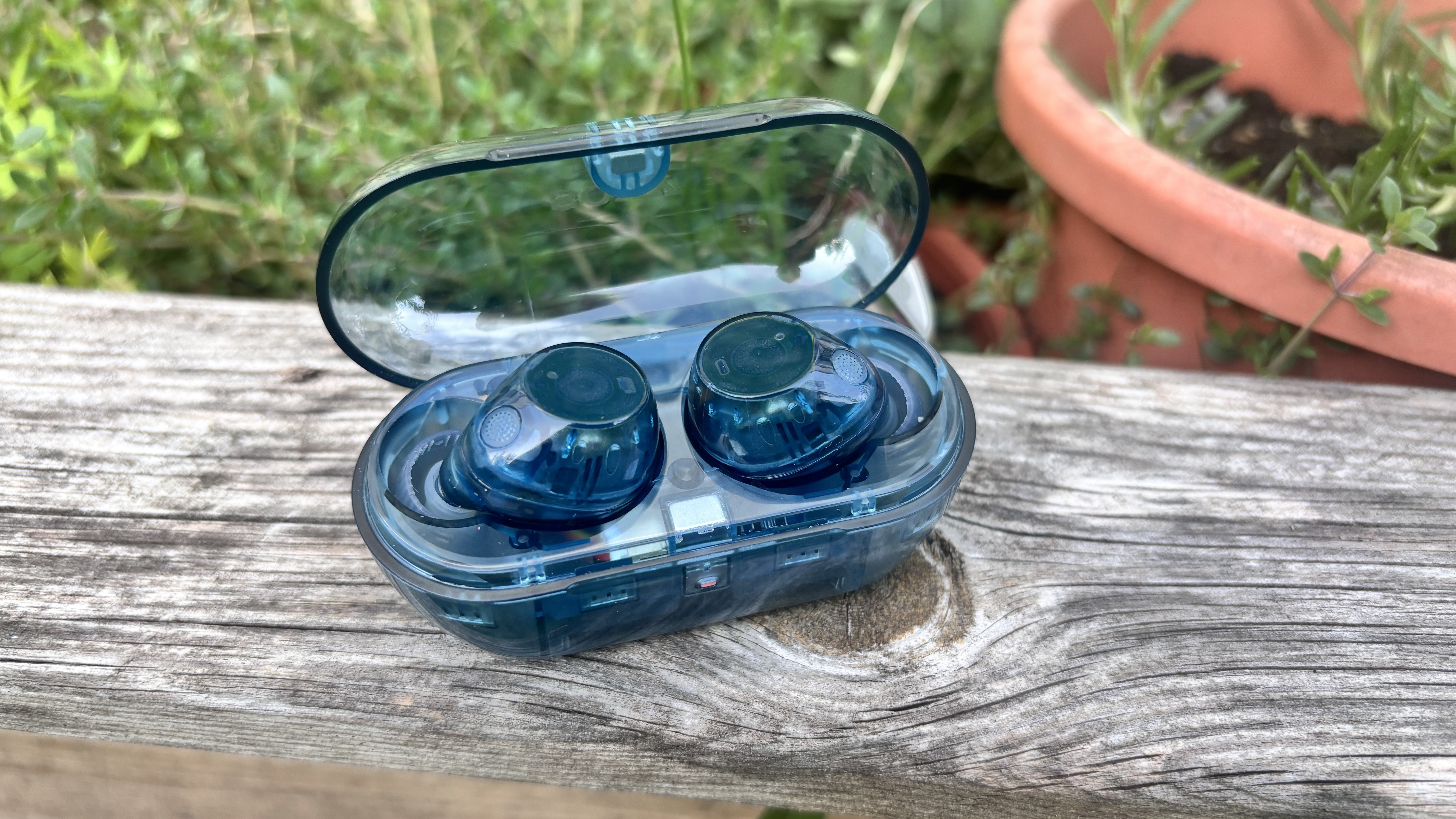 Sony WF-C710N earbuds in transparent blue in their charging case