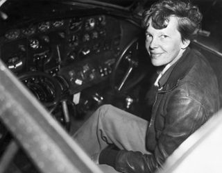 Amelia Earhart inside her airplane cockpit