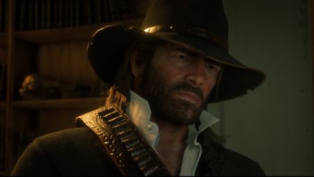 Red Dead Redemption 2 screenshot of Arthur Morgan who has shoulder length hair and a beard and wears a cowboy hat