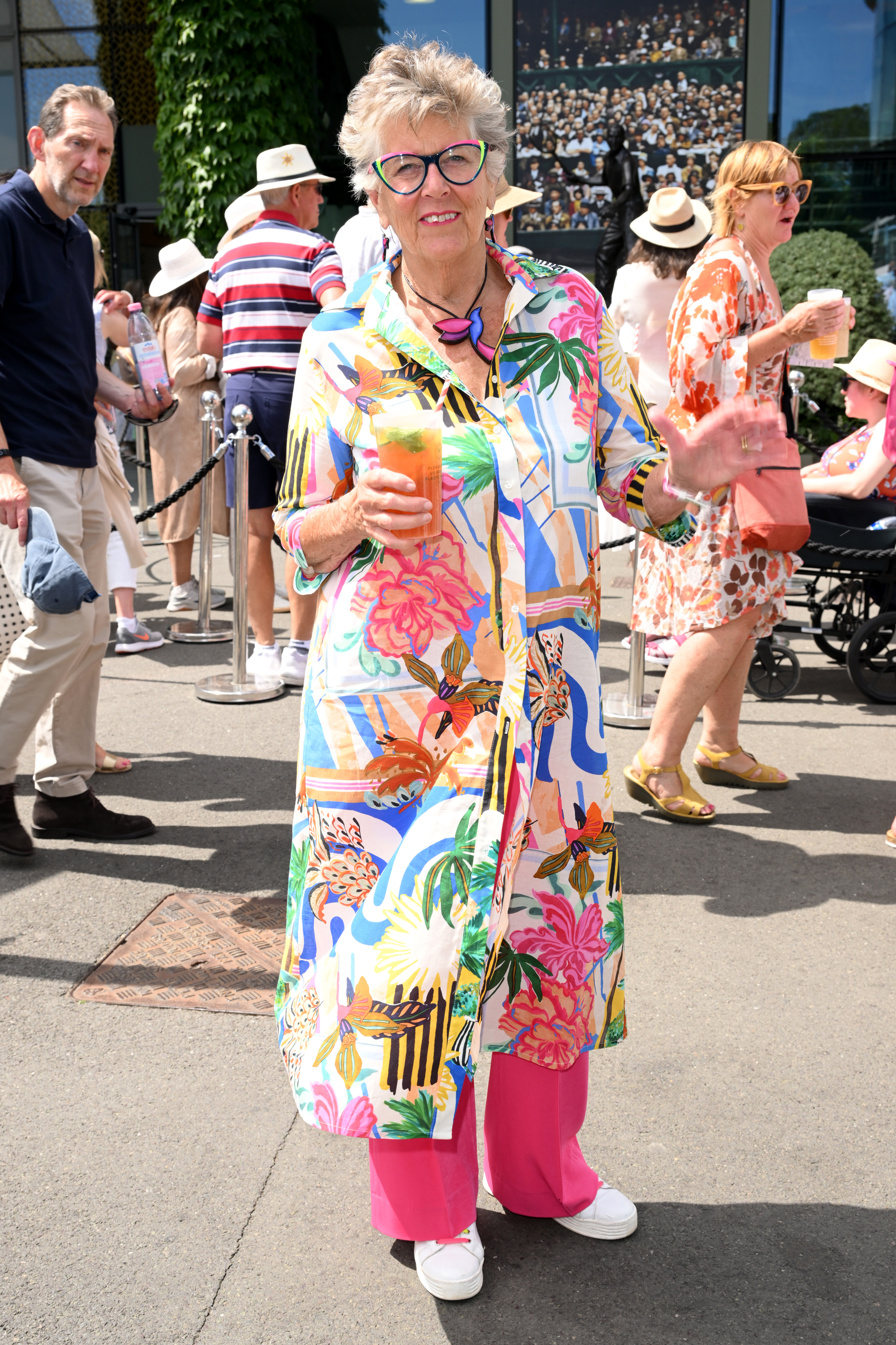 Prue Leith in printed shirt and pink trousers