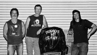 Zig Zags standing against a metal shutter